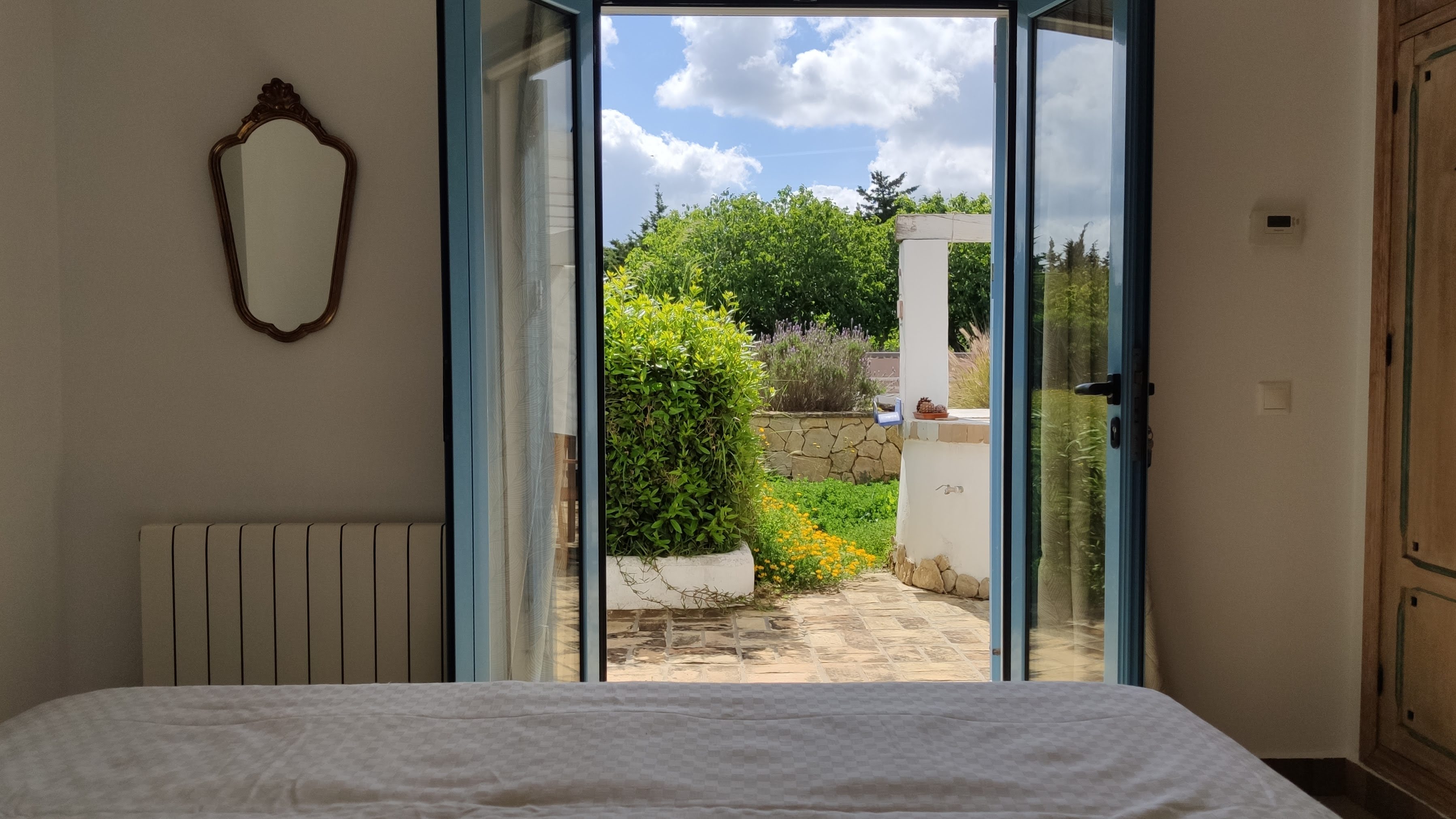 View from the bedroom out to the lavender garden and stone courtyard